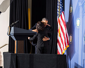 President Obama greets Chairwoman Ramirez with a hug.